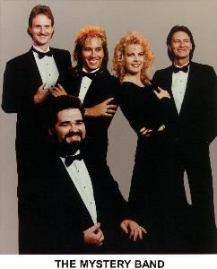 The Mystery Band - Formal Picture - This shot is of the 5 piece band, but we also offer a larger band by adding more horns up to ten pieces.  
The band also has music and wardrobe for just about any occasion you can think of: Roaring 20's; 40's USO Swing; 50's Sock Hop; 60's Hippies or Motown; 70's Disco Pimp Suits; 80's New Wave; Tropical; Country; Mardi Gras; Swamp Party; you name it . .  we can do it!