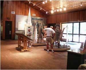 Minute Man Visitor Center Lobby, Minute Man National Historical Park, Concord — The Minute Man Visitor Center is conveniently located on Rte 2A (one mile west of I-95/128). Today the visitor
center lobby, theatres and grounds are available for use by the general public for permitted uses such as evening
social functions & other events. The park’s function manager is here to see that your event runs smoothly in a
manner that complies with conditions of the National Park Service and ensures the preservation of the landscape
and structure. Please read the rules and regulations to determine if they will correspond with your event plans.
