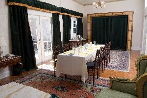 Hospitality Suites, The Don Vicente De Ybor Historic Inn, Tampa — The Hospitality Suite -
This unique suite has a king size Murphy bed that can be hidden away to accommodate a meeting of up to fourteen guests or an event after party of up to 30 guests.  This room features double French doors that open up to our 3rd floor piazza where you can enjoy the fresh air under strings of twinkle lights and a view of Centro Ybor.