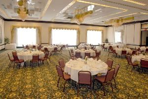 Ballroom, Park Inn Toledo, OH, Toledo — The crown jewel of the Park Inn Toledo meeting facilities is the elegant 5,500 sq. ft. Grand Ballroom with glistening chandeliers and large windows. The Total capacity at round tables is 600 guests.