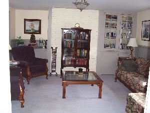Library, Cambridge House Bed and Breakfast, Cambridge — The library offers a great meeting space in a more casual setting. Kick off your shoes and get comfortable in a large wing chair, on the sofa, or even on the floor! Easily seats six, and can accomodate a few more. Makes a great break out room too. TV and DVD player in the room.