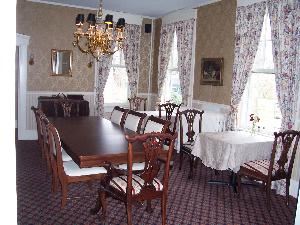 Main Dining Room, Cambridge House Bed and Breakfast, Cambridge — The dining room easily can be converted into a conference room setting that can comfortably seat 10 people. The room also has pocket doors that can be closed to create a separate meeting space from the adjoining parlor.