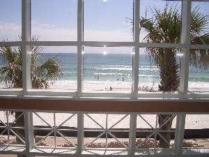 Beach Walk Crystal Beach, Destin — Beach Walk Crystal Beach is like the one and only heir to a rich tycoon. Its back wall (two stories, all glass) opens to a view that isn’t of a beach-off-in-the-distance but an immediate, present beach. It’s an arm’s length from the nearest indoor table and practically merging with the deck outside. Coconut white and wisped with seagrass, it barely holds back the green-blue Gulf of Mexico.