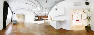 8443 Warner Studio, Culver City — 8443 Warner is the perfect place for private parties of up to 150 guests.The kitchen counters are butcher block and the bathroom is like a spa.  The 1500 sq. ft. main room can be arranged to accommodate any function.  The roll up door opens to an additional 1000 sq. ft. common area for larger parties.  Play your own iTunes through our wireless AirTunes or directly plug in an iPod.  The Bose speakers drench the space in sound.  Or watch your favorite sports event through the Epson projector on the 12'Hx20"W projection screen.