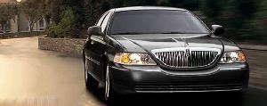 Lincoln Town Car L series with 6" extra leg room for rear seat passengers. Huge trunk space for luggage.