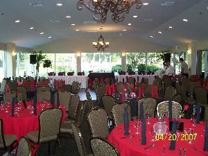 Banquet Hall, Pebble Creek Golf Club, Tampa — Large Banquet Room with large picture windows with stunning golf course views and french doors on three sides.  Peaked ceiling with chandeliers.  Opens to outdoor dining veranda.