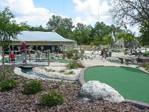 Ace Golf Range & Family Fun Center, Riverview — Party Barn overlooking Tropical-themed Miniature Golf Course