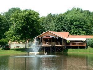 Lakeside Chalet, Cheers Chalet, Lancaster — Lake view of our beautiful event facility.  Set amongst a pleasant garden setting and sitting beside out picnic grounds.  Swans stay in the lake year round.  There is a deck that can be closed off and heated for the winter and a choice of 2 ceremony areas for weddings.