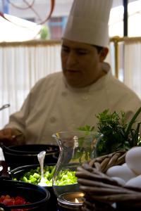 Event Photography-Client: Conrad Hotel, Indianapolis; Mother's Day Brunch; Image description: Guests enjoyed selecting from fresh produce for the chef to prepare meals of their choice at the "egg station" during the elegant Mother's Day Brunch at Conrad Hotel, Indianapolis.