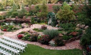 Outdoor Wedding Garden, Dominion House, Guthrie — The wedding garden is a breathtaking vision with its flagstone paths, beautiful waterfall, and exquisite landcaped grounds.