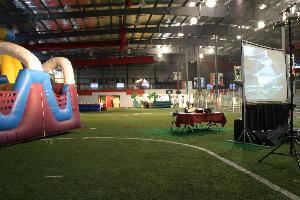 Field with party rentals set up