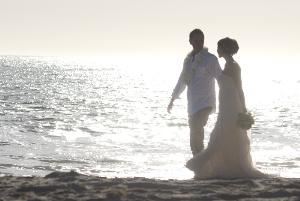 Wedding by Photo, Riverside — Photograph of a wedding on the beach.