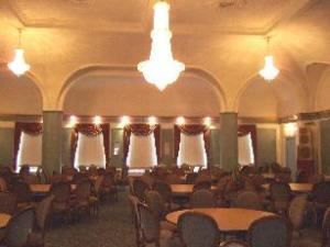 The Midtown Ballroom, Oakland — Our Grand Ballroom is complete with gorgeous gleaming chandeliers, ornate deco ceiling, velvet tasseled drapery and gold detailing through out. The impressive stage can be used for your head table or to feature a band, DJ or keynote speaker. Spacious hardwood floor for dancing. This room also includes it's own separate bar salon. Room also receives plently of natural light. The bride or other honored guest will find a lounge/changing room included with this ballroom.