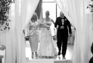 Photomasters Photography, Fort Lauderdale — We Can not explain it!  This photo Is one our Favorites.  The Black and White really showcases a time freeze on this moment!
The moment when their little girl walks down the isle for marriage and "Sails off Towards the Sunse". Here we go, they must be thinking.! The brides dream also is now, true and alive and happening, at the beginning of the walk down the isle where at the end ,...everything changes...