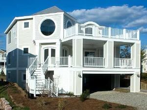 The Indian House, Resort Pointe, Fenwick Island — Surrounded by the clean, tranquil beaches of Fenwick Island, this sparkling new home offers great third-floor ocean views from enormous round tempered-glass windows and decks. Perfect for families with young children or groups of friends, the home features a walk-in shower, a soaking tub, and four shower/tubs, two of which are in Jack-and-Jill (with shared toilet) bathrooms; a large playroom with one full-size futon and two single futons; a room with two sets of bunks; three master suites with king-size beds; and one junior master suite with a queen-size bed. You’ll also find a den with a queen-size sleeper sofa.