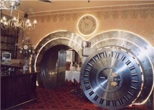 The Vault, The Broker Restaurant, Denver — This front door weighs 23 tons. Inside are four dining rooms. Two of these rooms (the A Room and the B Room) are used for private corporate dinners for up to eight guests.