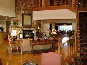 Country Inn & Suites By Carlson Deer Valley, Phoenix — Step into our warm lobby with lovely wood flooring and a grand staircase to the second floor!  The fireplace is surrounded by comfortable seating to relax and perhaps enjoy a good book from our 'Read It & Return' library which, of course, is complimentary to all guests.  One can catch up on the news on our TV in the Breakfast Room and enjoy a cup of hot coffee, tea or chocolate any time throughout the day, again, on us!  Our complimentary breakfast and evening snack is served here as well every day.