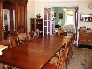 Entertainment area, Ashley Rose Victorian Inn, Cape May — This is the dining area, seats up to 18.  You can see the living room in the background.  The table can be reduce to as small as a 4x4 for banquet serving.  The livingroom is larger and opens to the wrap around porch