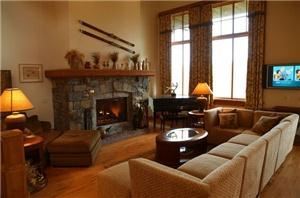 RESORT HOME at SPRUCE PEAK in STOWE, Stowe — A fabulous living room, dining room, kitchen, open plan with spectacular mountain and lake views from the floor to ceiling windows. Event guests can stay overnight and relatives and friends can have a more meaningful time than in separate hotel rooms. This lovely home is also a wonderful venue for retreats, reunions, parties, meetings, romantic getaways, and family vacations.