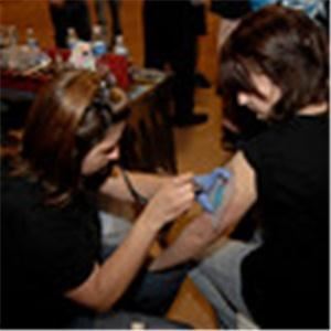 Spaztic DeSignz Airbrush Studio, Lawton — Our mobile studio is located in Southwest Oklahoma, but we have traveled to Arkansas and Texas airbrushing! We airbrush temporary tattoos and airbrush face designs that will wow any crowd! Call us today for your next event! Temporary body art, face painting and belly art/gestational art is available!