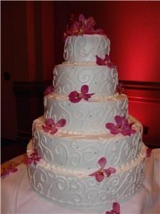 Confection Perfection, Acworth — 5 tier decadent and beautiful.  Scrolls with edible silver dragee beads.