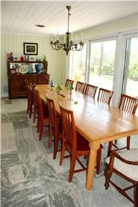 Casa Encantada, Casa Encantada, Palmetto — Spacious dining room looks out over 200 ft of waterfront.