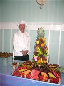 Scrumptious Suppers, LLC, Harrisonburg — Chef Vic standing by the fruit tree display