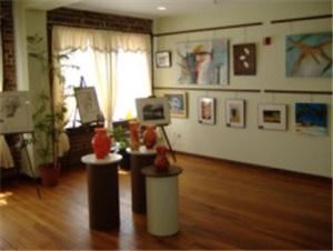The Gallery, DeLand Artisan Inn, Deland — ''The Gallery''
This intimate room is nice for small groups of up to 18 Guests' and can be set up for a Buisness meeting with screen for any presentation or "Theater style" for groups of up to 30 Guests' or even "Cafeteria style" for up to 24 Guests'. This room also Host's our "National Museum of Women in Art" Art Gallery, which is generally open to the public. All Artwork is for sale through the Artist and DAI accepts no commissions or fees.