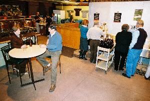 Enjoy snacks you've brought in or hot delivered pizza while you bottle up the special beers you brewed just two weeks earlier.  In the background, you can see a new group starting the brewing process under the guidance of one of our expert Brew Coachs.
