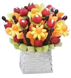 FruitFlowers, Belleville — Grand Floral Fruit Design serves 10-15 people. Our signature design and best seller contains honeydew, cantaloupe, pineapple, strawberries and grapes. Also available- dipped strawberries, kiwi, watermelon, and apples can be added to almost any basket.