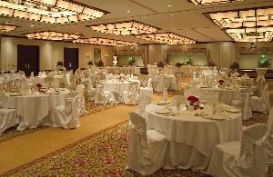 Regency Ballroom, Hilton Lisle/Naperville, Lisle — Celebrate in grand style! Featuring over 5,200 square feet, the Regency Ballroom can accommodate up to 360 guests for a wedding reception and 480 guests for dinner. Decorated in tasteful hues of ivory and gold, it is sure to please your style. Adjoining to the Ballroom is the 1,200 square foot Atrium. The Atrium boasts 16-foot ceilings with a skylight, which makes a perfect setting for a cocktail reception before the big event!