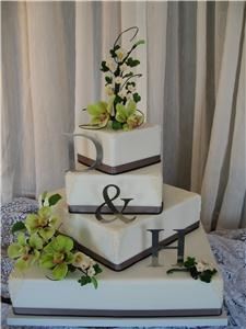 Susan L. Griffin - Designer, Moosomin — Susan’s 30 years of experience in cake decorating combined with her formal floral design training and her artistic talent ensure the designs are exquisite and spectacular.  Every wedding anniversary or corporate cake that Susan designs is an original, created exclusively for your event. 
Choose a style that is traditional, contemporary, or whimsical and Susan will include elements or items that have significance to you.  
 Her designs are featured on display cakes of any shape, colour or theme.  Susan specializes in Canadian Wild Flowers and cold-porcelain floral art.
Each flower will be handcrafted petal by petal and leaf by leaf making your cake a masterpiece that will exceed the expectations of you and your guests.  

 “Hot New Trend”  “Bridal Bouquet Reproductions”  Susan will reproduce your bridal bouquet in cold porcelain to create a beautiful memento of your special day.