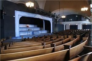 Auditorium, Northwest Neighborhood Cultural Center, Portland — The auditorium at Northwest Children's Theater & School seats 400 comfortably, 500 with limited view. We are located in the Northwest Neighborhood Cultural Center, and our audiences love the historic pews and vaulted ceiling. Space amenable to special events, lectures, presentations, graduation ceremonies, dramatic weddings, and intimate concerts. Tours by appointment only. Advance booking strongly recommended.