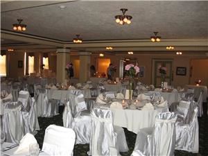 Ward Plaza Restaurant, Pub & Ballroom, Aberdeen — This photo shows the mezzanine section of the Ward Plaza Crystal Ballroom fully set and decorated for a wedding. Photo shown includes optional features including decorator provided centerpieces and chair covers.