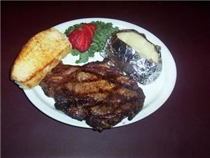the MarketPlace Catering - Mitchell, Mitchell — One of our Steak House favoriets ~ Grilled Ribeye with baked potato and Grilled French Bread.