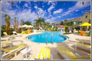 Mike Ditka Resorts Runaway Beach Club, Kissimmee — The Key West styled pool engages all with the ultimate in safety and fun. A zero depth entry allows all ages to have as little or as much water touch their bare feet as they desire. The water features are brightly colored, and allow water to fly all over in all directions in the pool. Your will have the time of your life.