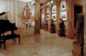 Miami Beach Penthouse Parties, Miami Beach — Grand piano, gilded mirror and stone statues line the hallway.