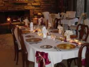 Dining Room, The Inn At Bella Vista, Bella Vista — The Inn’s dining room looks out over the hills of Bella Vista. 

Dining at the Inn is designed to be a special event. Dinner is served by candlelight with care given to all the details. Fine china, crystal, place cards and soft music add to the ambiance. The menus are developed weekly and reflect the taste and style of Bill and Beverly.