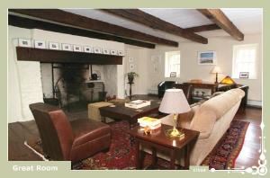 Great Room, Inn At Glencairn, Princeton — Great Room with a twelve foot wide original cooking fireplace, and is decorated with fine antiques throughout, a revolving art collection, and oriental carpets over random width pine floors.