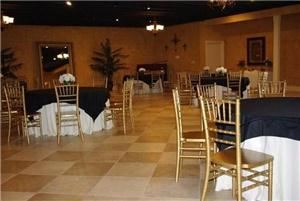 Elegant Memories, Baton Rouge — Our Ballroom is set to your request with floorlength ivory drapes on round tables with black or ivory toppers. Framed by Gold Chivari Chairs and silk centerpieces.