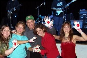 Home Team Handz, Falls Church — Xmas Handz at Santa Jam at the State Theatre in Falls Church, Virginia. Make more noise with our exclusive "Party Handz" that are being used at Weddings, Bar Mitvahs, Concerts, Birthday Parties...anytime you want to add some zip to your affair get our Handz into your guests hands!