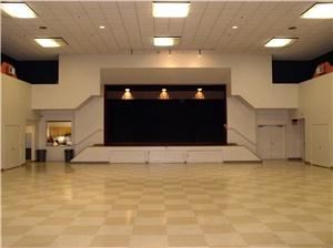 Holly Auditorium, Holly Community Center, Union City — A view of the stage and banquet floor.  The full kitchen is visible to the left of the stage.