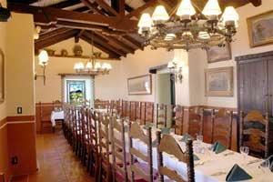 Portola, El Adobe De Capistrano, San Juan Capistrano — this long private room with thick adobe walls, stained glass window niches, and artfully restored vaulted wood ceiling is perfect for small group dining.Portola seats up to 40 guests