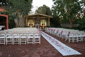 Garden & Chapel, El Adobe De Capistrano, San Juan Capistrano — The enclosed Garden and Chapel area offers the perfect setting for a wedding ceremony… or an outdoor barbecue. The brick patio is surrounded with garden beds vibrant with trees & flowers. Trees twinkle with lighting at night. An architectural arch and altar with back-lit stained glass window create the "Chapel" area of the garden, near the Veranda.
Garden & Chapel up to 70 guests, ceremony seating 250