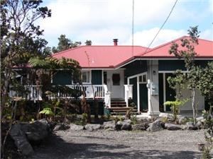 Ohia Plantation House, Ohia Paniolo Cottage, Volcano — This plantation style home invites you to enjoy the true spirit of aloha. The home is surrounded by Ohia Lehua and Tree Ferns (hapu’u). Its large wrap-around deck allows you to enjoy the morning sun. You can relax in the jacuzzi, barbeque your favorite steak on the gas grill while you sit and enjoy Hawai’i at it’s best, in the cool, serene, and peaceful setting of this unique rain forest.