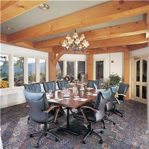 Strauss Room, Trapp Family Lodge, Stowe — On a more intimate scale, the Strauss Room features a boardroom table and executive leather chairs, suitable for up to 14 people with views of our gardens and mountain landscapes. This meeting room is ideal for day conferences or breakout sessions. The Strauss Room offers executive leather chairs, phone conference capabilities, and high-speed wireless Internet with stunning views. The Strauss Room is 350 square feet in size and has the following setup options