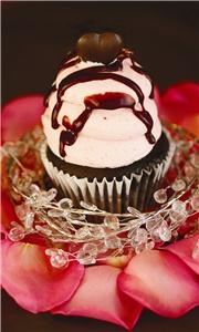 Gigi's Cupcakes of Littleton, Littleton — Devil's food cake with dark chocolate chips baked in. Pale pink butter cream frosting, drizzled with chocolate ganache and topped with a chocolate heart. Elegant and beautiful custom cupcakes available.