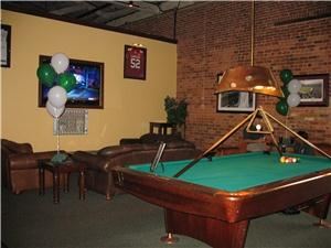 Gamecock Alley, Jillian's Eat Drink & Play, Columbia — Gamecock Alley is a relaxed semi-private space that offers 2 Brunswick billiards tables, 1 ping pong table and i shuffleboard table to play on. Hang out and watch the game on a 65 inch TV on the leather sofas or on one of the 3 other 42 inch TV's. Perfect for a birthday party, after work social, drop in event or holiday party. Ask abbout adding the Wii. 
$80 per hour and includes unlimited play on all 4 table.