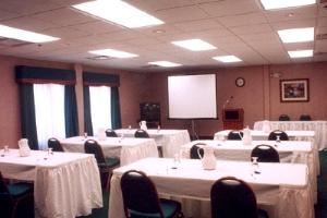 Conference Room, Holiday Inn Express Hotel & Suites Jacksonville-South, Jacksonville — Our meeting room comes with free flip charts, projection screen, and an overhead projector.