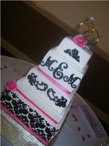 Delectable Delights By Debbie, Amherst — Buttercream cake with fondant accents. Real ribbon.